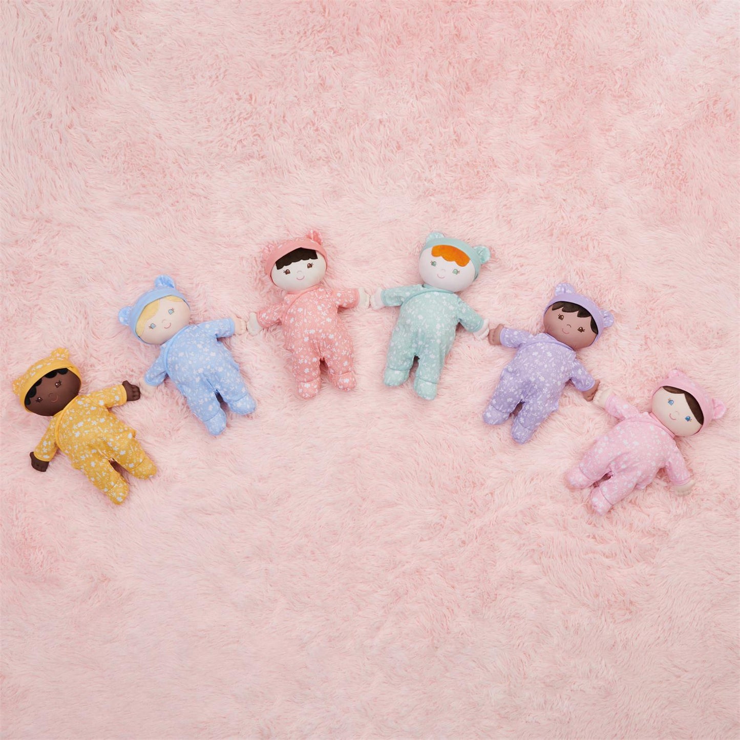 Plush Baby Doll Sustainable Hibiscus Dressed In A Peach Onesie